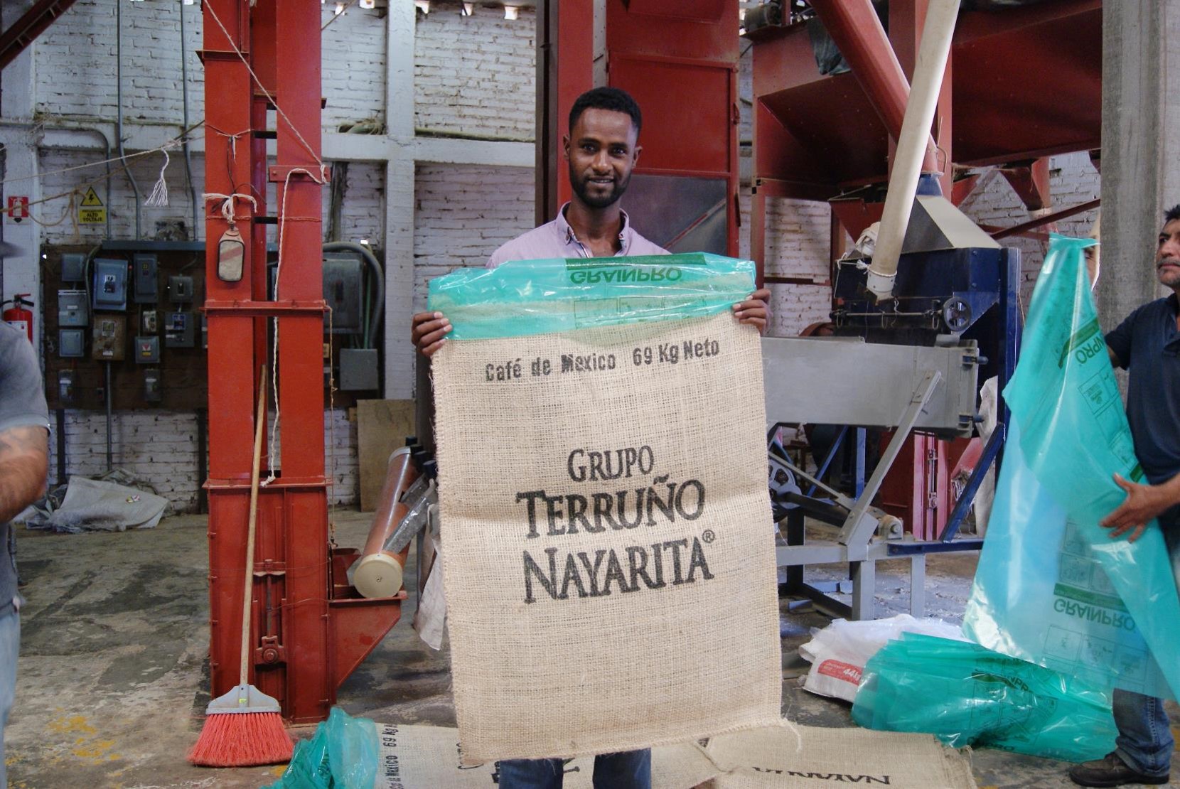 Mengistu holding a sisal bag.